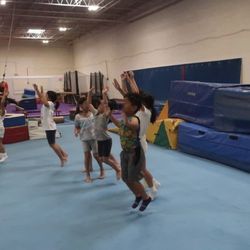 Coach James leads the birthday celebration group in fun pre-lunch gym time.