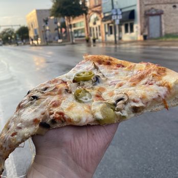 New York Pizza - a hand holding a slice of pizza - Pizza Near Me - Hartwell, Georgia New York Pizza - a hand holding a slice of pizza - Pizza Near Me - Hartwell, Georgia
