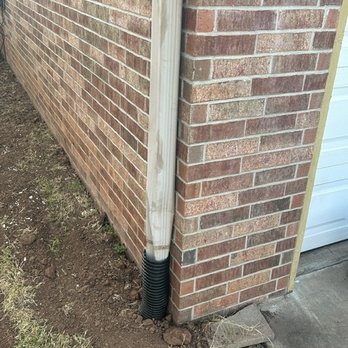 American Irrigation & Landscaping - After: Gutters connected to French Drain - Landscaping Near Me - Edmond, Oklahoma American Irrigation & Landscaping - After: Gutters connected to French Drain - Landscaping Near Me - Edmond, Oklahoma