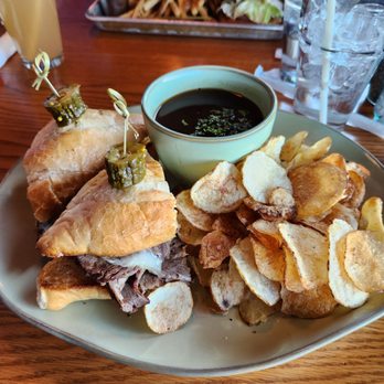 LU LU Craft Bar + Kitchen - French dip made with prime rib and provolone cheese awesome broth and house made chips - Bars Near Me - Richland, Washington LU LU Craft Bar + Kitchen - French dip made with prime rib and provolone cheese awesome broth and house made chips - Bars Near Me - Richland, Washington
