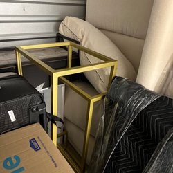 Two Men and a Truck - The sofa that was wrapped to move but uncovered in storage unit.