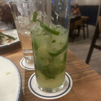 Salt Traders Coastal Cooking - KICKIN' PINEAPPLE NOJITO Mint, lime, jalapeño, pineapple syrup, agave, soda - Seafood Near Me - Round Rock, Texas Salt Traders Coastal Cooking - KICKIN' PINEAPPLE NOJITO Mint, lime, jalapeño, pineapple syrup, agave, soda - Seafood Near Me - Round Rock, Texas