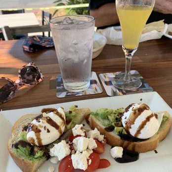 Junction 52 Bar & Grill - Avocado Toast with feta, tomato & balsamic vinegar. I like my eggs poached, but they'll serve it to you the way you like it. - New American Near Me - Santee, California Junction 52 Bar & Grill - Avocado Toast with feta, tomato & balsamic vinegar. I like my eggs poached, but they'll serve it to you the way you like it. - New American Near Me - Santee, California
