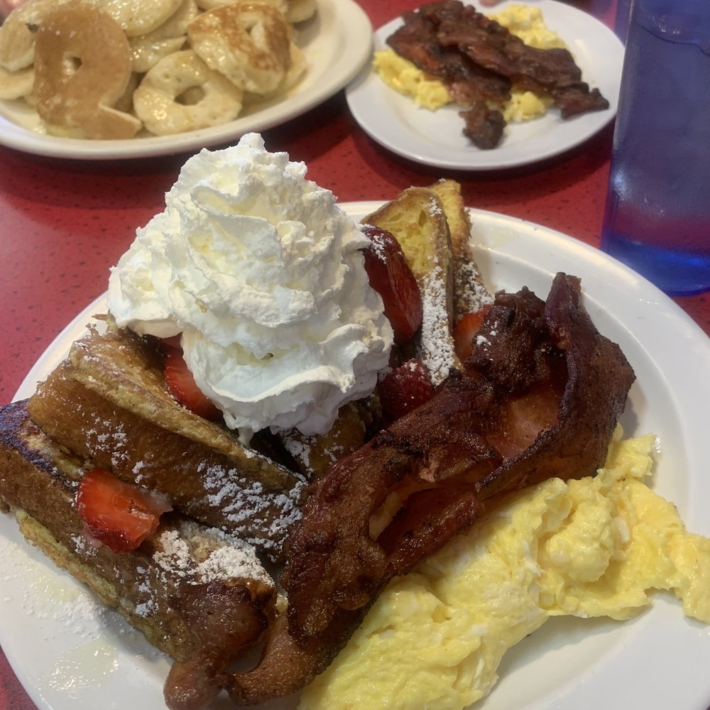 Joes Cafe - French toast combo with strawberries and behind is a pancake combo! - Breakfast & Brunch Near Me - Orem, Utah