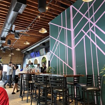 Half Sour - Inside. Wood bar at end of pic. - New American Near Me - Chicago, Illinois Half Sour - Inside. Wood bar at end of pic. - New American Near Me - Chicago, Illinois