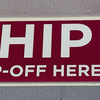 CopyTec - A rectangular sign on a wall provides shipping drop-off information, with the word 'SHIP' in large white letters and 'DROP-OFF HERE' below. It lists drop-off times for UPS at 3:30, FedEx at 4:00, and USPS at 4:00, with their respective logos on the right side. - Printing Services Near Me - Pleasant Grove, Utah