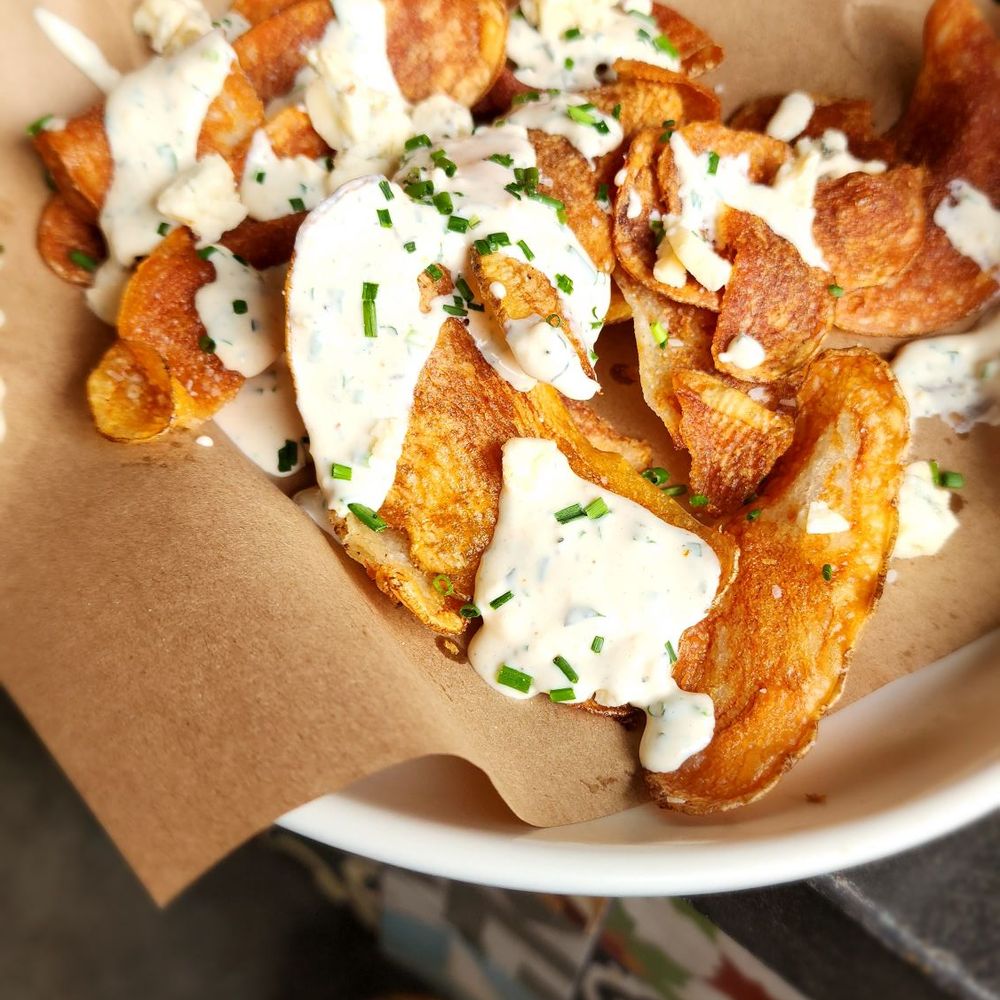 Culinary Dropout - Not on the menu. They made it for us.  Housemaid chips with blue cheese and chives.  Just forgot the balsamic - New American Near Me - Austin, Texas