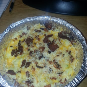 Jus' Mac - Half baked potato. Potatoes are mixed in with the mac and cheese. I wasn't sure at first (but I eat with my mouth not my eyes) - Comfort Food Near Me - Houston, Texas Jus' Mac - Half baked potato. Potatoes are mixed in with the mac and cheese. I wasn't sure at first (but I eat with my mouth not my eyes) - Comfort Food Near Me - Houston, Texas