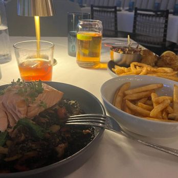 Ocean 99 - Salmon dish and crab cakes with fries. - Seafood Near Me - Bethany Beach, Delaware Ocean 99 - Salmon dish and crab cakes with fries. - Seafood Near Me - Bethany Beach, Delaware