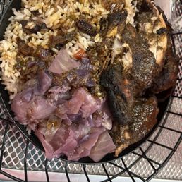 Jerk chicken with rice and peas and cabbage . 10/10 .