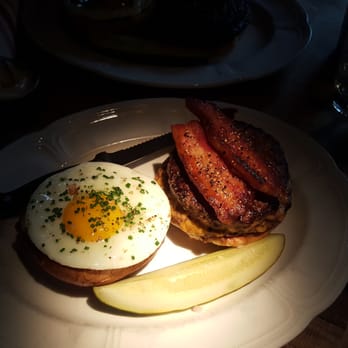 Au Cheval - Single Burger with a pickle, fried egg, and thick-cut bacon. - Bars Near Me - Chicago, Illinois Au Cheval - Single Burger with a pickle, fried egg, and thick-cut bacon. - Bars Near Me - Chicago, Illinois