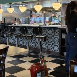 Metro Diner - Bar and stool in front of open kitchen