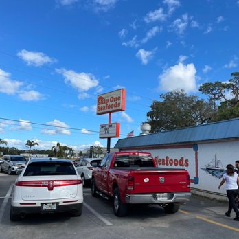 Skip One Seafood Restaurant - two trucks parked in a parking lot - Seafood Near Me - Fort Myers, Florida Skip One Seafood Restaurant - two trucks parked in a parking lot - Seafood Near Me - Fort Myers, Florida