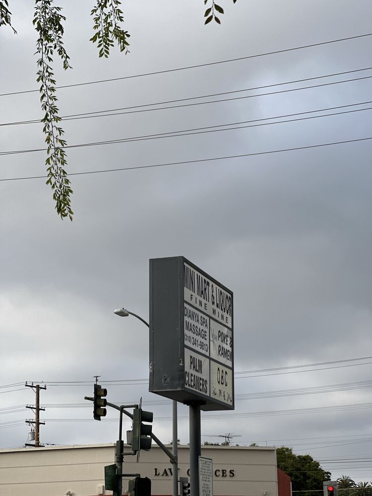 Overland Mini Mart and Liquor Logo