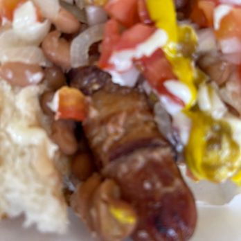 El Güero Canelo Restaurant - The Sonora dog has a bacon wrapped wiener beans onions tomato &Mustard - Mexican Near Me - Tucson, Arizona El Güero Canelo Restaurant - The Sonora dog has a bacon wrapped wiener beans onions tomato &Mustard - Mexican Near Me - Tucson, Arizona