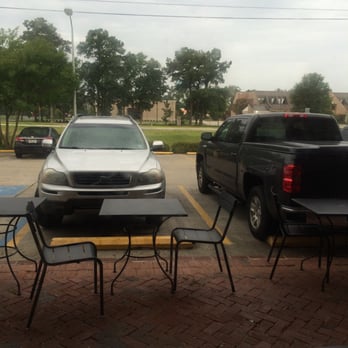 Starbucks - View from outdoor seating area. Catch a cool breeze or vehicle exhaust. - Coffee & Tea Near Me - Mandeville, Louisiana
