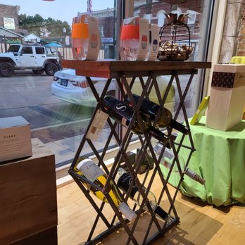 The Crystal Cork - a wine rack in front of a window - Beer, Wine & Spirits Near Me - Dixon, Illinois
