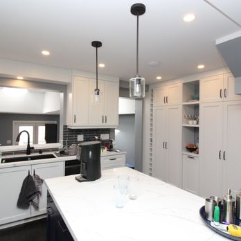 Kozak Renovations - a kitchen with white cabinets and white countertops - General Contractors Near Me - Toronto, Ontario Kozak Renovations - a kitchen with white cabinets and white countertops - General Contractors Near Me - Toronto, Ontario
