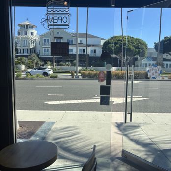 Swagyu Burger - View from inside of the outside through the entrance glass doors - Burgers Near Me - Newport Beach, California