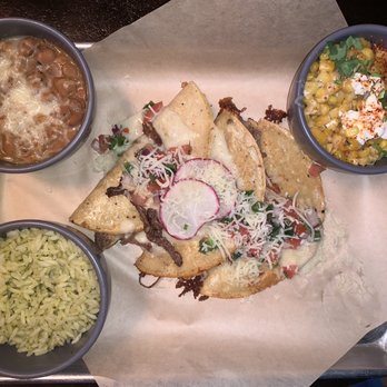 The Local - Street Enchilada (shredded beef) with sides of Cilantro Lime Rice, Chato Beans and Street Corn - Fantastic meal. - Mexican Near Me - Abilene, Texas The Local - Street Enchilada (shredded beef) with sides of Cilantro Lime Rice, Chato Beans and Street Corn - Fantastic meal. - Mexican Near Me - Abilene, Texas