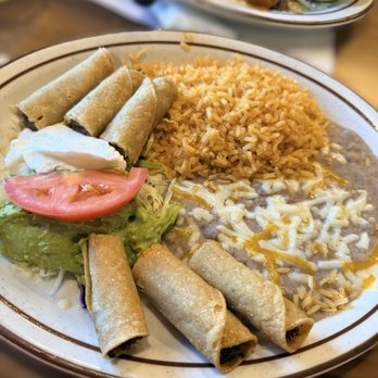 Casa Lupe - Taquitos platter with all the garnishes includes rice and beans. - Mexican Near Me - Yuba City, California Casa Lupe - Taquitos platter with all the garnishes includes rice and beans. - Mexican Near Me - Yuba City, California