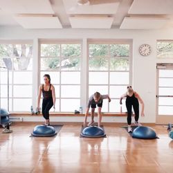 Light-filled annex studio for fitness, pilates mat, and yoga classes.