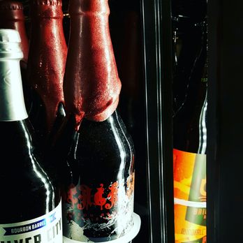 Peaks and Pints - A gorgeously bottled beer by Tacoma Brewing(Black Sun is the name of the beer) at Peaks and Pints. - Beer Bar Near Me - Tacoma, Washington