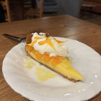 Good Bones - Lemon cream pie with tangerine, lemon curd, brown butter graham, citrus marigold Chantilly -- Petite Percebes residency at Good Bones - Comfort Food Near Me - Caspar, California
