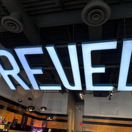 a sign that reads revel