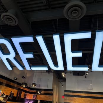 Revel 77 Coffee - a sign that reads revel - Coffee & Tea Near Me - Spokane, Washington