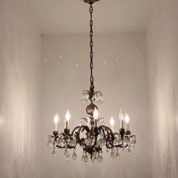 Vintage chandelier in the staircase.