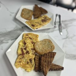 The Creperie Corner - Bacon egg cheese omelette with hash brown & toast