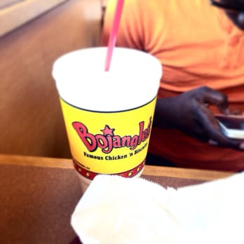 Bojangles - man using his cell phone - Fast Food Near Me - College Park, Georgia