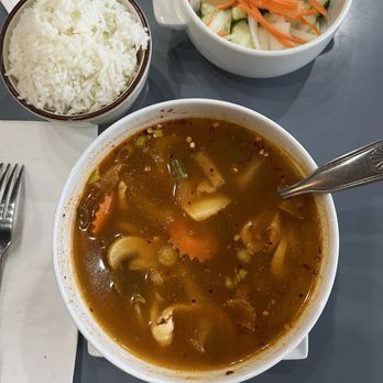 Siam Bistro Thai Fine Dining - Tom Yum soup with jasmine rice and a cucumber salad - Thai Near Me - Clovis, New Mexico Siam Bistro Thai Fine Dining - Tom Yum soup with jasmine rice and a cucumber salad - Thai Near Me - Clovis, New Mexico