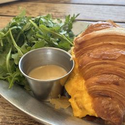 Croissant with eggs & cheese, spring mix Croissant with eggs & cheese, spring mix