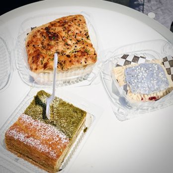 Fireproof Coffee - L to R: Matcha coffee cake, chili crisp focaccia, and earl grey blueberry poptart. - Coffee & Tea Near Me - Redlands, California Fireproof Coffee - L to R: Matcha coffee cake, chili crisp focaccia, and earl grey blueberry poptart. - Coffee & Tea Near Me - Redlands, California