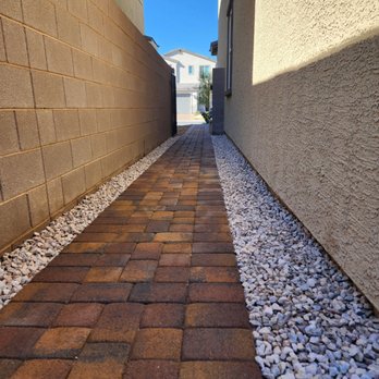 Maqueda Lawn Services - a brick walkway between two houses - Lawn Services Near Me Maqueda Lawn Services - a brick walkway between two houses - Lawn Services Near Me