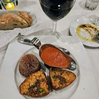 Piccola Osteria - Internal view of Arancino Siciliano, Salsa Marinara, Nero d'Avola red wine - Italian Near Me - Santa Clarita, California Piccola Osteria - Internal view of Arancino Siciliano, Salsa Marinara, Nero d'Avola red wine - Italian Near Me - Santa Clarita, California
