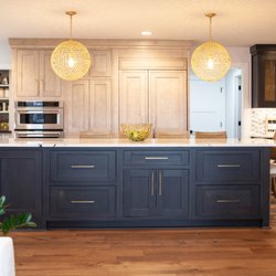 Nicholas Design Build - Large island, two-toned cabinetry, and built-in refrigerator