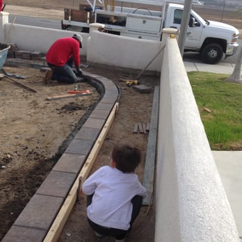 Andrew Landscape Construction - My little helper checking out Wayne's helpers. Everyone was SO NICE to my son, who loves watching anything construction related. - Landscaping Near Me