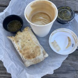 Steak breakfast burrito and cafe latte. Steak breakfast burrito and cafe latte.