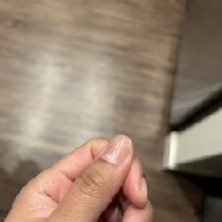 Golden Nail Bar - Broken nail left unfixed after an hour long manicure.