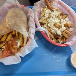 Main Street Gyro - Traditional Pork Gyro (left) and Greek Fries, small (right)
