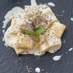 Paccheri di Gragnano with provolone and black truffle flakes Paccheri di Gragnano with provolone and black truffle flakes