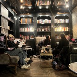 Ground Central Coffee - Back room filled with books and people.