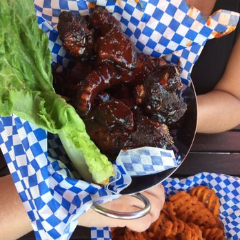 Sunset Cove Beach Cafe & Club - a plate of ribs, lettuce, and sweet potato fries - New American Near Me - Buford, Georgia Sunset Cove Beach Cafe & Club - a plate of ribs, lettuce, and sweet potato fries - New American Near Me - Buford, Georgia