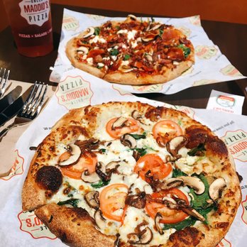 Uncle Maddio's - FRONT: White crust, alfredo sauce, mozzarella, goat cheese, tomato slices, spinach, mushroom, caramelized onion - Pizza Near Me - High Point, North Carolina Uncle Maddio's - FRONT: White crust, alfredo sauce, mozzarella, goat cheese, tomato slices, spinach, mushroom, caramelized onion - Pizza Near Me - High Point, North Carolina