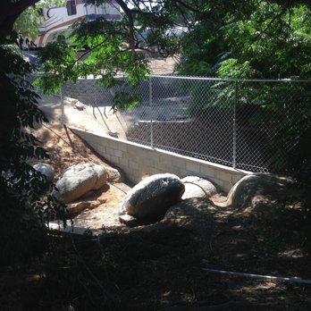 Riverside Fence - Wall with pass through for rainwater creek. - Fences & Gates Near Me - Riverside, California