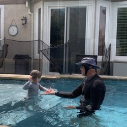 Swim2John - John giving our son a high five after doing a good swim
