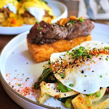 Catch 122 - Steak N Egg: bulgogi hanger steak, sunny egg (requested over-medium), rice cake, warm kimchi slaw, steak sauce, edamame ($19). - Breakfast & Brunch Near Me - North Vancouver, British Columbia Catch 122 - Steak N Egg: bulgogi hanger steak, sunny egg (requested over-medium), rice cake, warm kimchi slaw, steak sauce, edamame ($19). - Breakfast & Brunch Near Me - North Vancouver, British Columbia